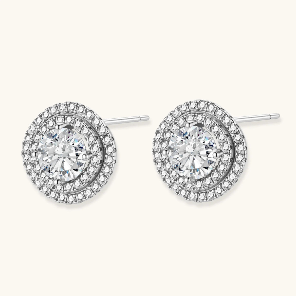 Double halo sterling silver stud earrings with brilliant round moissanite center stones and pavé crystal accents