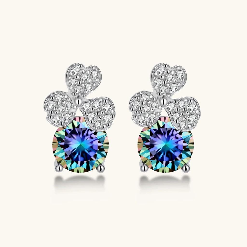 Sterling silver stud earrings with four-leaf clover design featuring small crystals above round moissanite stones