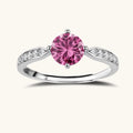 Brilliant pink moissanite ring in sterling silver 4-prong setting with accent stones on adjustable band